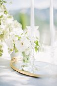 White posy and candles on outdoor wedding table (Ravello, Italy)