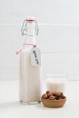 Hazelnut milk in a glass bottle
