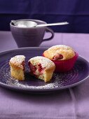 Cream cheese muffins with raspberries and icing sugar