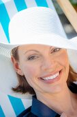 Woman wearing white sun hat