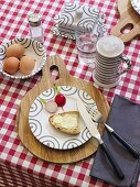 A table laid for supper with bread, butter, radishes, eggs and beer