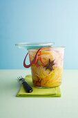 Pickled vegetables with star anise in a flip-top jar