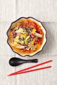 Spicy sour soup with duck, bamboo shots, peppers, Chinese mushrooms and noodles