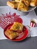 Puff pastries filled with strawberries and pistachios