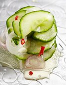 Spicy cucumber salad with onions and chilli peppers