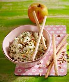 Apple and kohlrabi coleslaw with breadsticks and sunflower seeds