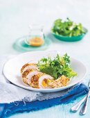 Breaded turkey rolls stuffed with couscous & oranges