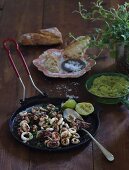 Squid with chilli, limes, grilled parsley and guacamole