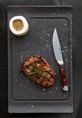 Grilled ribeye steak with sauce