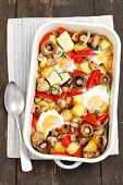 Eggs baked with vegetables (potatoes, courgette, mushrooms, pepper)