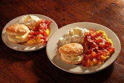Scrambled eggs with bacon, American biscuits and grits