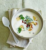Cream of parsnip and potato soup with pumpkin seed gremolata