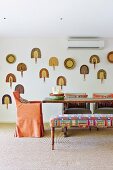 Collection of bast compartments above the dining table with upholstered furniture