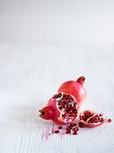 Pomegranates, whole and sliced open