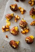 Figs with brie wrapped in ham with macadamia nut caramel