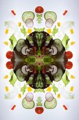 A digital composite of mirrored images of a mixed vegetable salad