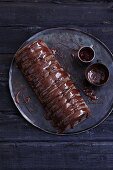 Gluten-free chocolate log cake with chocolate glaze