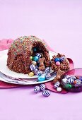 Puffed rice coconut chocolate dome with colourful Easter egg filling