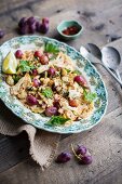 Cauliflower salad with red grapes, parsley and pul biber