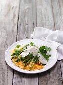 Breakfast omelette with green asparagus and white radish