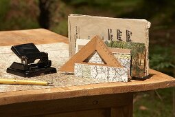 Office supplies and map on desk outdoors