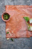 Kohlrabi, Parmesan and herbs on a cloth