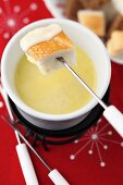 Cheese fondue with cubes of bread