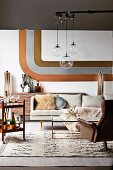 Retro living room, pendant lights with glass ball above coffee table and leather armchair, stripe decor in metal look on wall