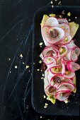 Spiral radish salad with grapes and pistachio nuts