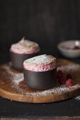 Mini raspberry soufflés in baking moulds