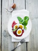 Beetroot purée with hard-boiled eggs and spinach