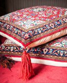 Oriental cushions with red tassels