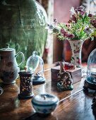 Curiosities on exotic-wood table