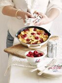 Bread pudding with raspberries in a pan