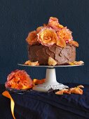 A chocolate ganache cake decorated with roses