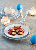 Aubergine rolls with mozzarella and tomato sauce for Christmas