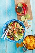 Chicken salad with kidney beans, cherry tomatoes and limes (Mexico)