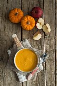 Butternut squash and apple soup in a saucepan