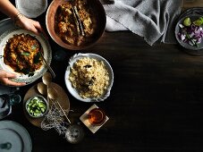 Lamb korma & sour barramundi curry with side dishes (Asia)