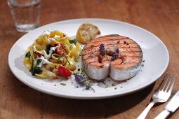 Salmon steak with tagliatelle, vegetables and lavender