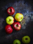 Various organic apples on a metal surface