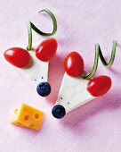 Cheese mice with cherry tomato ears and blueberry noses