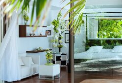 Bedroom decorated with vases of flowers