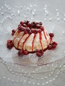 A white cake with cranberries