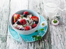 Berry muesli with mint and daisies