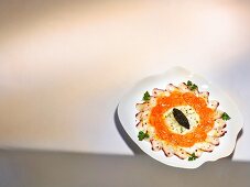 A dish by Harald Wohlfahrt: carpaccio of salmon, branzini and scallops