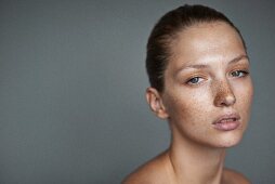 A portrait of a young woman with lots of freckles