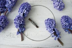 Tying a wreath of hyacinths