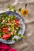 A mixed leaf salad with grapefruit and edamame beans served with a sweet-and-spicy ginger and maple syrup sauce