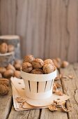 An arrangement of walnuts in a wooden basket